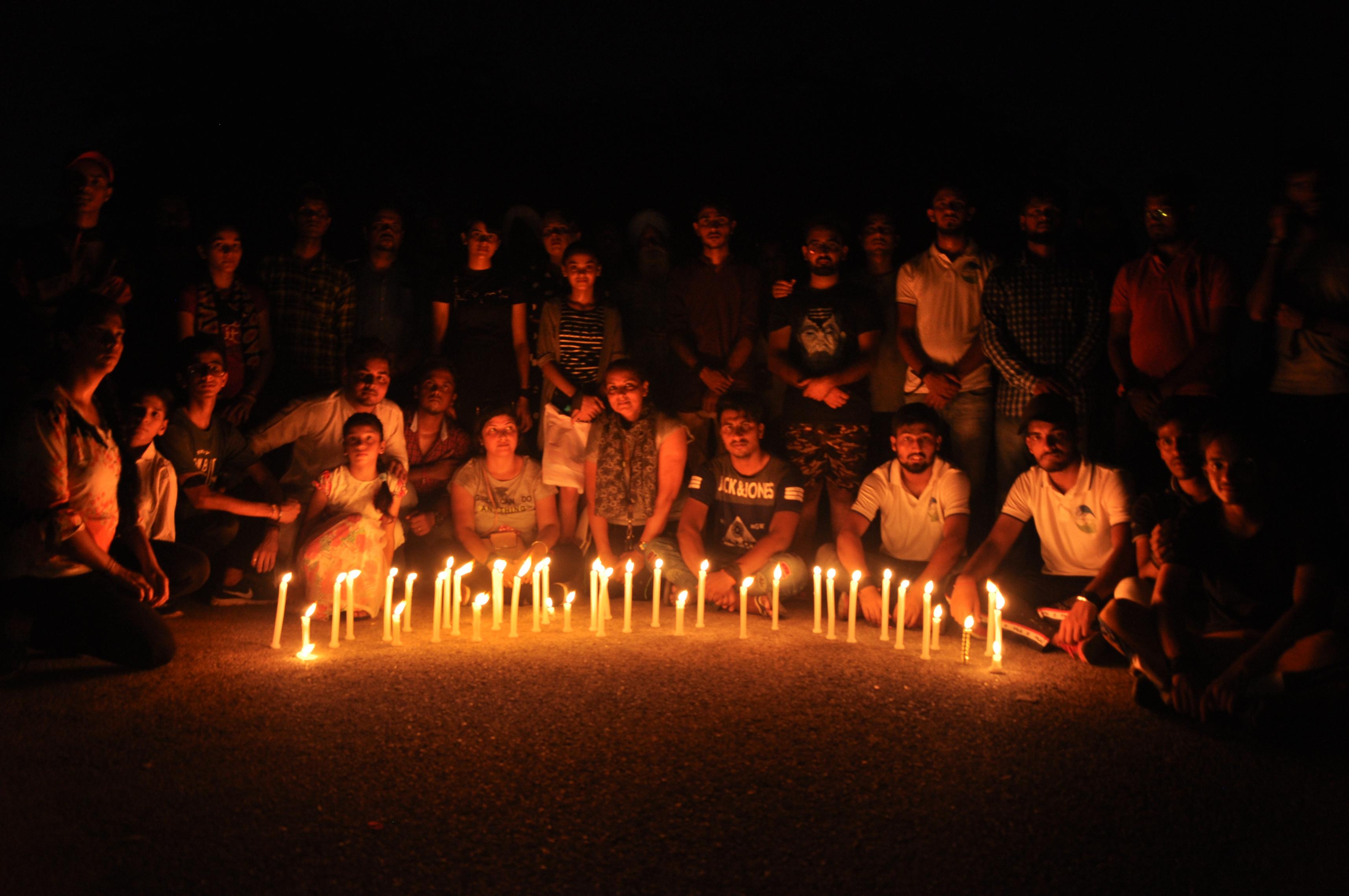 Candle march draws attention towards plight of stray dogs