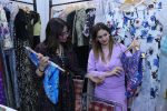 An exhibitor showing a designer top to a visitor at the 3 day ‘Global Fashion’ Exhibition at Kisan Bhawan, Sector 35, Chandigarh.